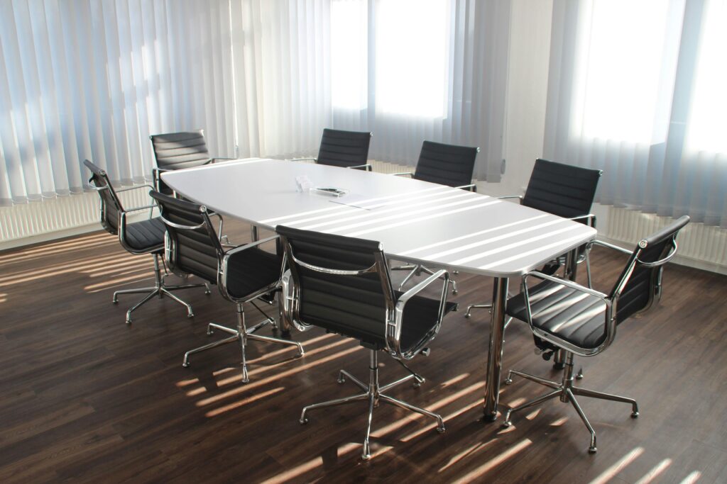 pexels photo 416320 416320 Modern office meeting room with designer chairs, table, and large windows.