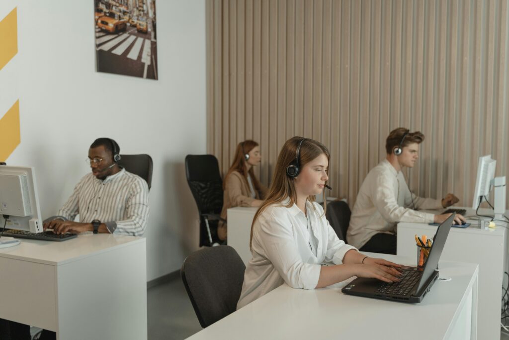 pexels photo 5453909 5453909 Office scene with call center employees at work, focusing on teamwork and productivity.